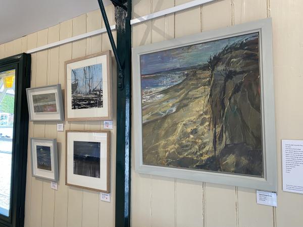 Some paintings hung at the exhibition